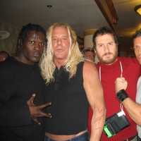 <p>Giovanni Roselli (right) poses with WWE wrestler &quot;R-Truth&quot; (left) and &quot;The Wrestler&quot; star Mickey Rourke (second from left).</p>