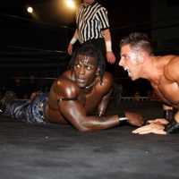 <p>Giovanni Roselli (right), known to wrestling fans as &quot;Romeo Roselli,&quot; battles &quot;R-Truth&quot; in the ring. </p>