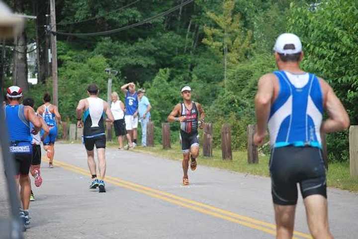 Easton&#x27;s Chris Thomas heads for first place among amateur athletes in Sunday&#x27;s 70.3 mile Ironman race in New Hampshire. 