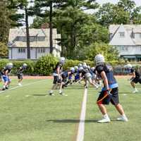 <p>Players line up and prepare to practice a drill. </p>