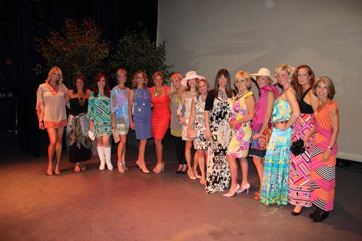 Models from a past Lyn Evans fashion show pose at The Ridgefield Playhouse.