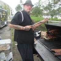 <p>Tim Doherty of Bobby Q&#x27;s smokes meat at the Blues, Views and BBQ Festival in Westport.</p>