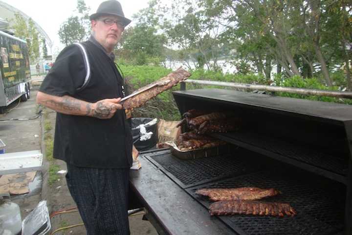 Tim Doherty of Bobby Q&#x27;s smokes meat at the Blues, Views and BBQ Festival in Westport.