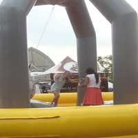 <p>There was an entire row of inflatable fun games such as the Wrecking Ball at the Blues, Views and BBQ Festival.</p>