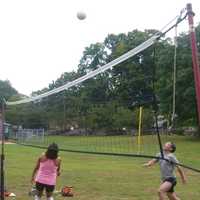 <p>A group of friends gathers together for a game of volleyball in Barrett Park in Stamford on Monday on the unofficial end of summer.</p>