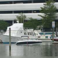 <p>A boat glides back into its mooring in Stamford near Cummings Beach on Labor Day, the unofficial last day of summer.</p>