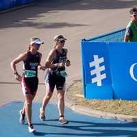 <p>Amy Dixon, right, a blind triathlete, runs with guide Lindsey Cook in the World Triathlon Championships.</p>