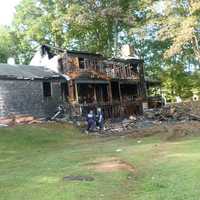 <p>A home at 25 Bittersweet Lane in North Stamford was destroyed by an early morning fire Wednesday. The three occupants escaped. The cause is under investigation.</p>