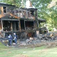 <p>A home at 25 Bittersweet Lane in North Stamford was destroyed by an early morning fire Wednesday. The three occupants escaped. The cause is under investigation.</p>