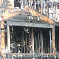 <p>A home at 25 Bittersweet Lane in North Stamford was destroyed by an early morning fire Wednesday. The three occupants escaped. The cause is under investigation. Pictured is a section of the back of a home.</p>