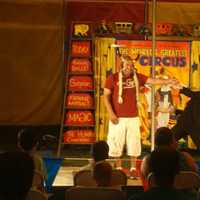 <p>An audience member takes part in one of the circus performances in the Kids&#x27; Cove Big Top Theater.</p>