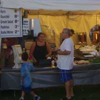 <p>Attendees get food at one of several vendors at the Norwalk Oyster Festival.</p>