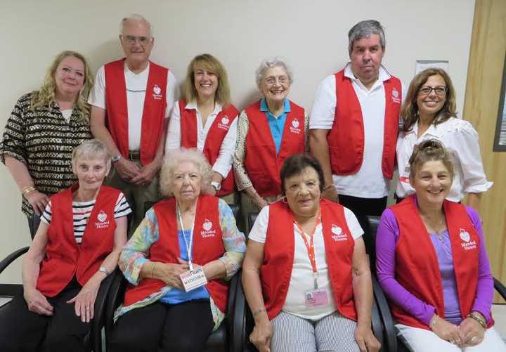 Mended Heart Visiting Program volunteers, Chapter President Eileen Pezzo, Alfred Kiederer, Robin Zencheck, Theodora Farrell, John Hackett and chapter VP Cathy Ahern. Bottom row: Marilyn Galligan, Shirley Johnston, Theresa Russo and Carmela DeNobile.