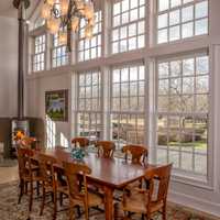 <p>The dining room has a lot of natural sunlight. </p>