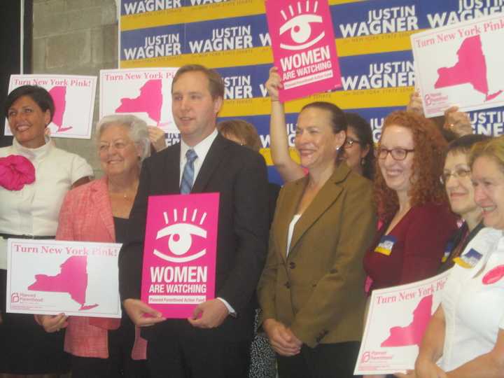 Justin Wagner flanked by supporters at a rally in Thornwood. 