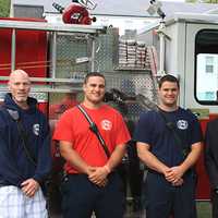 <p>Firefighters attend the ceremony to remember victims of Sept. 11 on Thursday at Wooster School in Danbury.</p>