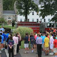 <p>Students and staff at Wooster School in Danbury gather for the ceremony to commemorate Sept. 11.</p>