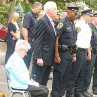 <p>Attendees pause to remember during the 9/11 memorial ceremony in New Canaan.</p>