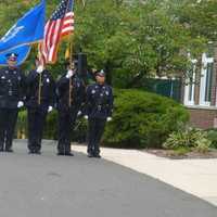 <p>The New Canaan Police Honor Guard marches at the 9/11 ceremony Thursday morning.</p>