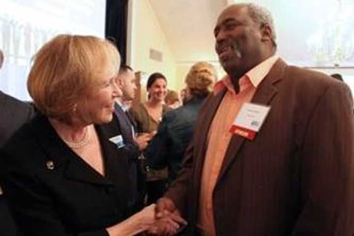  Alana Sweeny, president and CEO, United Way of Westchester and Putnam, greets Larry Coleman, senior safety/materials supervisor, AkzoNobel, at United Ways Best Chefs and Fine Wines event.