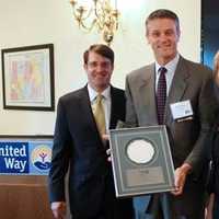 <p>Greg Bassuk, Esq.,  left, board chair, United Way of Westchester and Putnam and Alana Sweeny, president and CEO of United Way of Westchester and Putnam, present an award to  David Yawman of PepsiCo.</p>