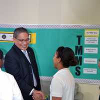 <p>John Marshall shakes sixth-grader Kai Blakes hand.</p>