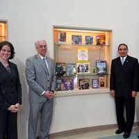 <p>John Marshall poses with C.E.S. leaders in front of a display case dedicated to his father, Thurgood Marshall, at the Thurgood Marshall Middle School at Six to Six Interdistrict Magnet School in Bridgeport. See story for names.</p>