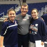 <p>Wilton eighth-graders Bridgette Wall and Kaitlin Reif pose with UCONN women&#x27;s basketball coach Geno Auriemma.</p>