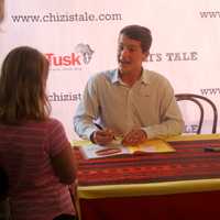 <p>Greenwich teen Jack Jones and Zimbabwe illustrator Jacqui Taylor sign copies of &quot;Chizi&#x27;s Tale&quot; for young fans.</p>