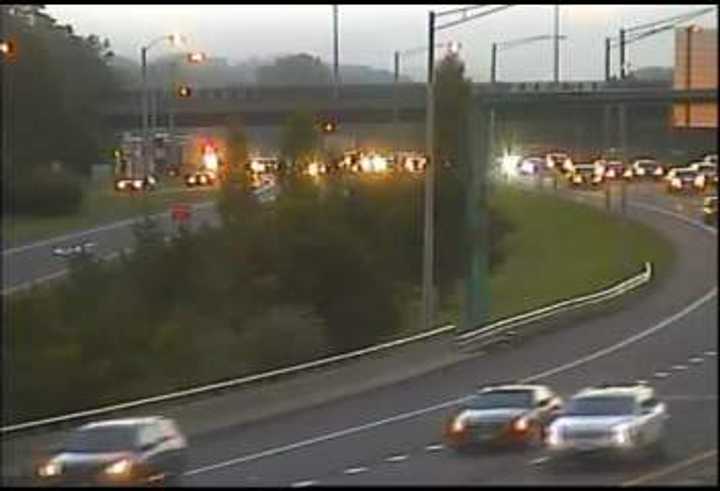 A tractor-trailer crash, upper left, is blocking a lane of westbound I-84 in Danbury.