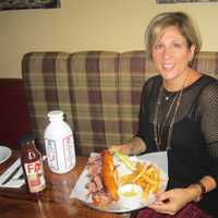 <p>Audrey Hochroth in front of a pastrami sandwich, one of the delicacies offered at Fat Sal&#x27;s.</p>