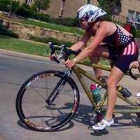 <p>Amy Dixon, right, and Caroline Gaynor race on the bike at the U.S. National Paratriathlon Championships.</p>