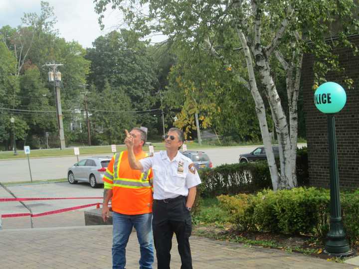 Lt. Kevin Soravilla and Mike Samuels looking up at the sky where they saw a UFO fly over the Yorktown Police Department.