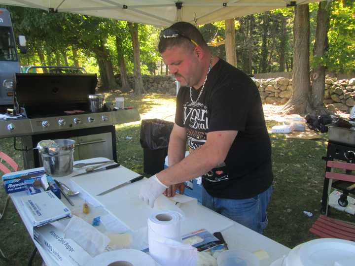 Antoneos Kalmanidis making some of his famed pulled pork.