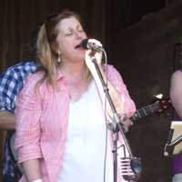 <p>Singers perform at the Ambler Farm&#x27;s fall festival on Sunday.</p>