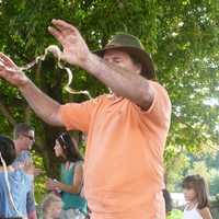 <p>It&#x27;s not a snake, it&#x27;s an apple peel made by an old-fashioned apple peeler. Jared Silbersher, of Pound Ridge, N.Y., was giving demonstrations of apple peeling and apple slicing using pre-electric technology at Ambler Farm&#x27;s fall festival Sunday.</p>