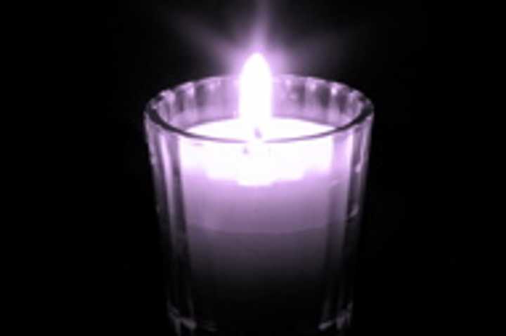 Remember the victims of domestic violence at a candlelight vigil in October. 