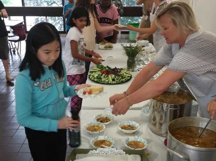 Pocantico Hills School fourth-graders harvest vegetables and herbs from their garden for the school&#x27;s Soup Day.