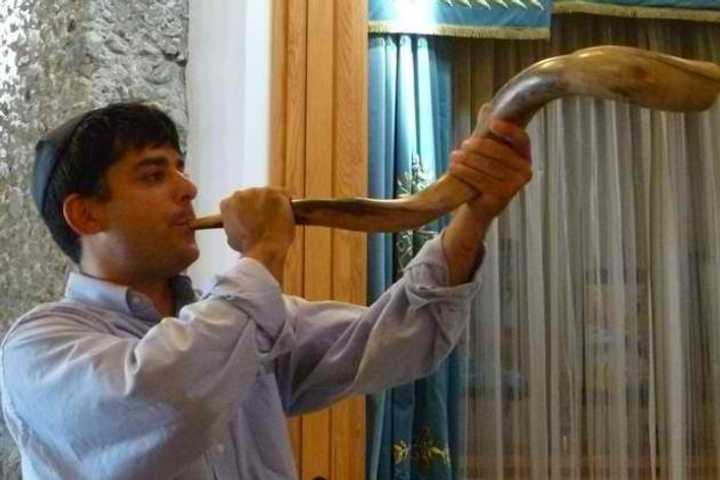 The blowing of the shofar, a Jewish horn used on Yom Kippur