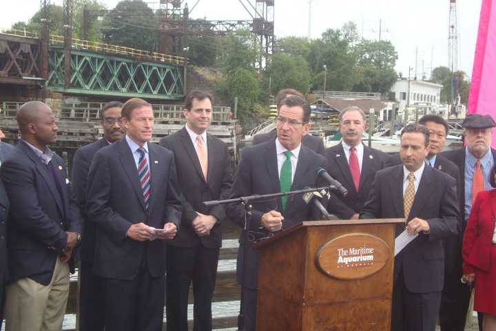 Gov. Dannel Malloy, surrounded by local, state and federal officials, announces funding and scheduling is in place to complete the Norwalk Walk Bridge replacement by 2020.