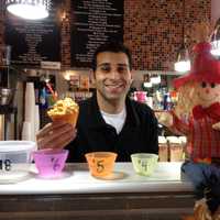 <p>Albert Borrelli serves pumpkin gelato at J.J. Beans.</p>