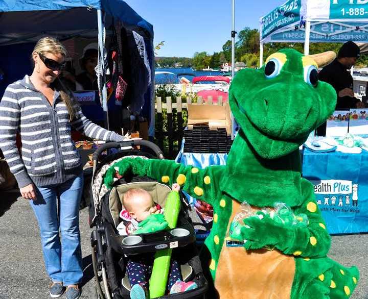 Families and children join in on the street fair. 