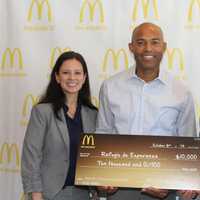 <p>Jessica Mato, and Josh Kaufman presenting the $10,000 donation on behalf of McDonalds New York Metro Owner/Operators Association to New Rochelle&#x27;s Mariano Rivera.</p>