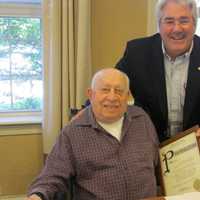 <p>Tuckahoe Mayor Steve Ecklond issuing a proclamation to Sal Sgroe.</p>