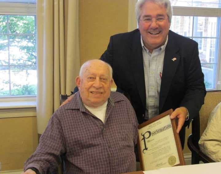 Tuckahoe Mayor Steve Ecklond issuing a proclamation to Sal Sgroe.