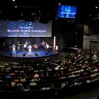 <p>The worship center is a state-of-the-art room with a 40-foot wide video screen and new Bose sound system. </p>