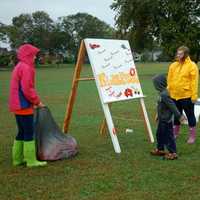 <p>Student volunteers assist a visitor at KIDZFEST in Norwalk last Saturday.</p>