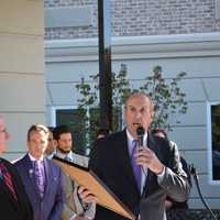 <p>Deputy County Executive Kevin Plunkett (right) hold a proclamation at The Bristal at Armonk&#x27;s grand opening. Pictured to the left is County Legislator Michael Smith.</p>