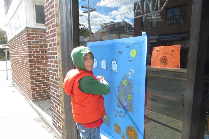 Harrison Stores Deck Out Windows For Halloween Season
