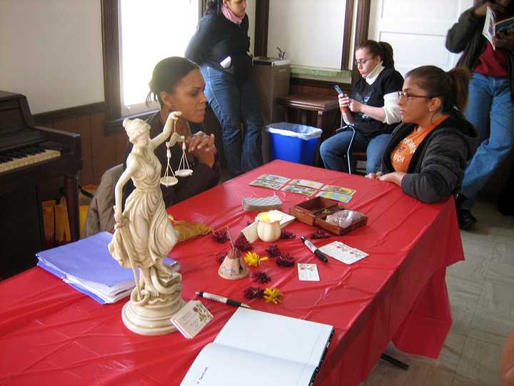 A psychic conducts a reading at the Putnam Valley Psychic Fair. 